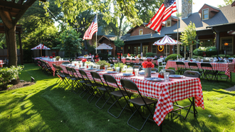 Outdoor 4th of July party setup with red and white checkered tablecloths and American flags
