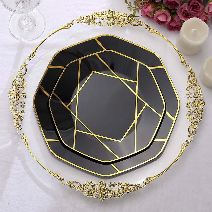 Elegant black and gold geometric plates stacked on a white tablecloth.