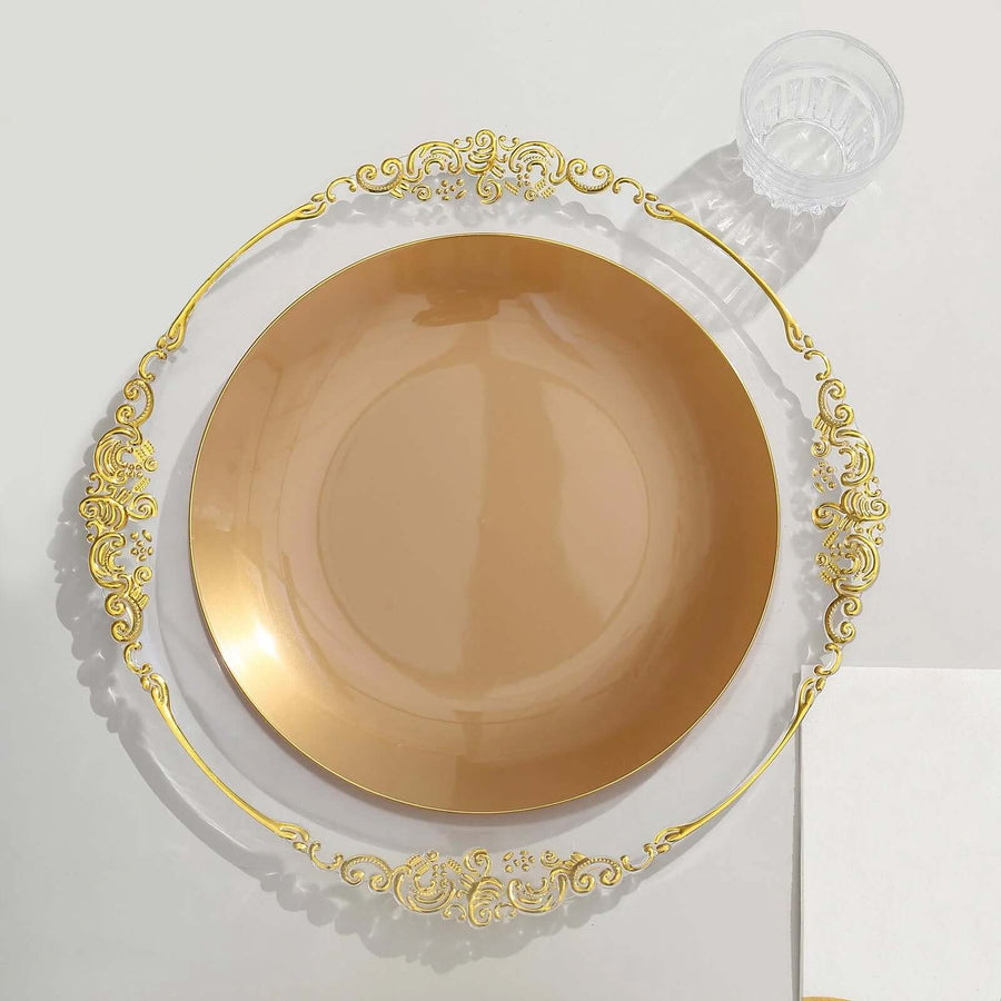 Elegant gold rimmed plate on a plain backdrop with a clear cup and napkin.