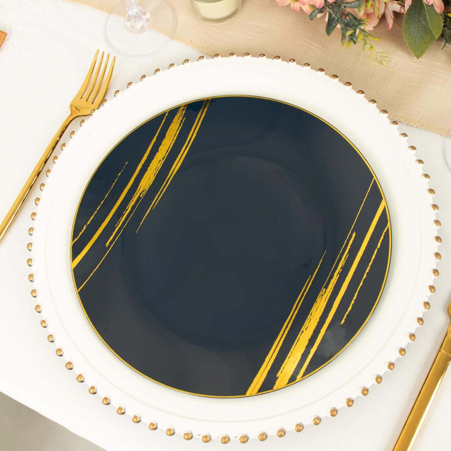 Elegant navy blue plate with gold accents and stylish brushstroke design.