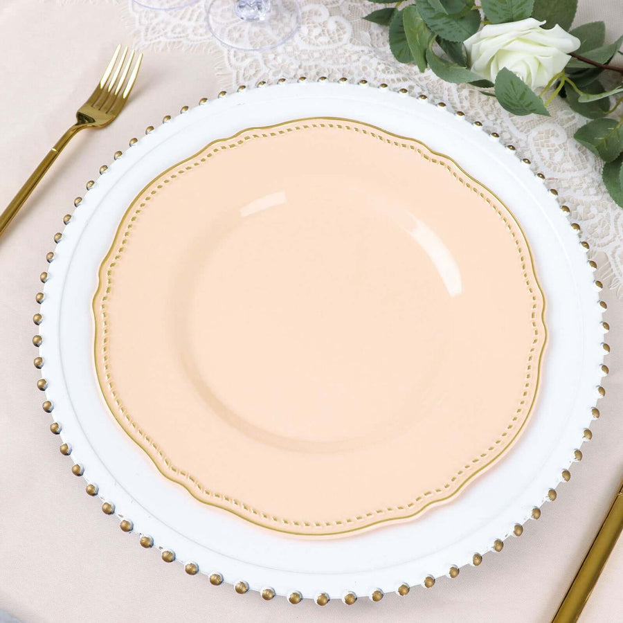Peach decorative plate on white charger with gold bead trim