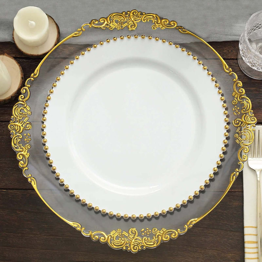 Elegant decorative plate with gold trim and beaded accents on a wooden table.