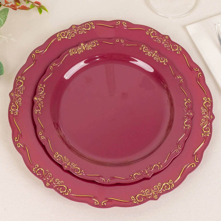 Elegant burgundy plates with gold trim, perfect for dining occasions.