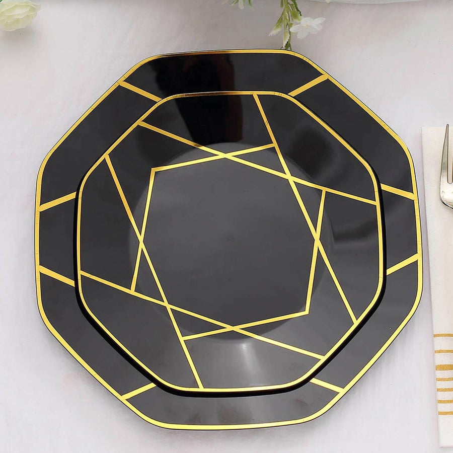 Black octagonal plate with gold geometric design on a plain background.