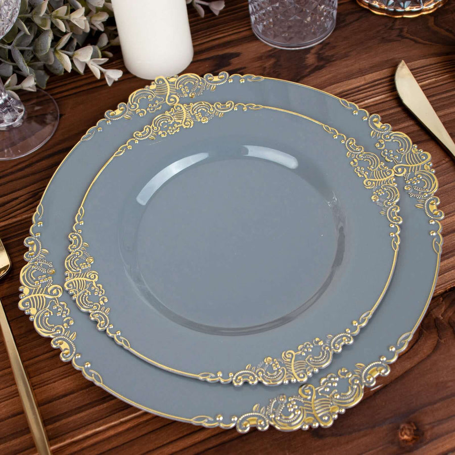 Decorative gray plate with gold accents on a wooden table setting.