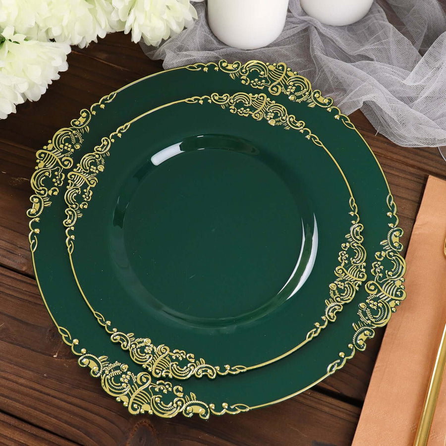 Elegant green plates with gold trim on a rustic wooden table.