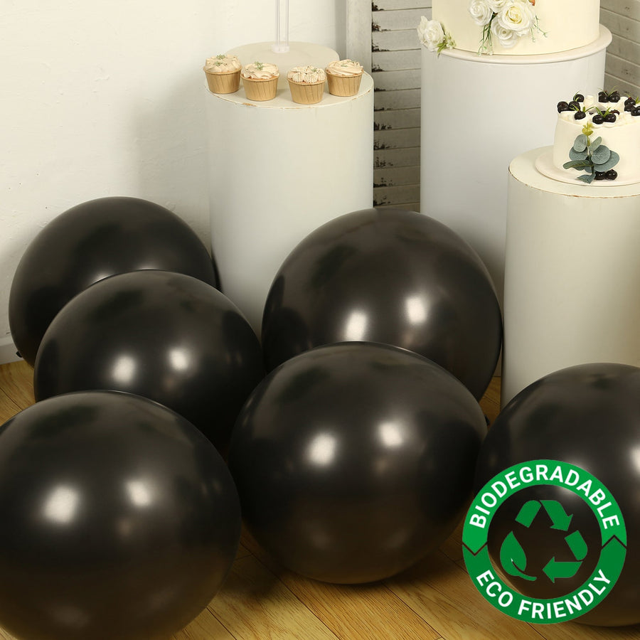 Black biodegradable balloons in a festive setting. Eco-friendly celebration decor.