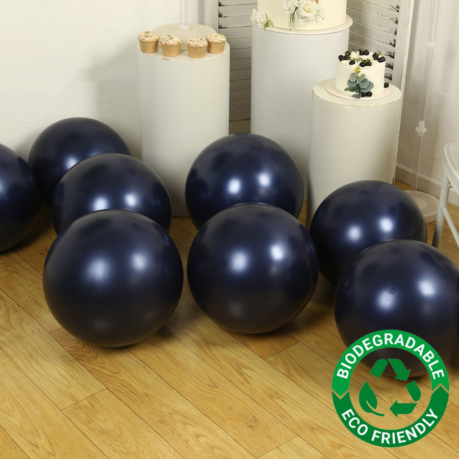 Biodegradable navy blue exercise balls on a wooden floor. Eco-friendly design.