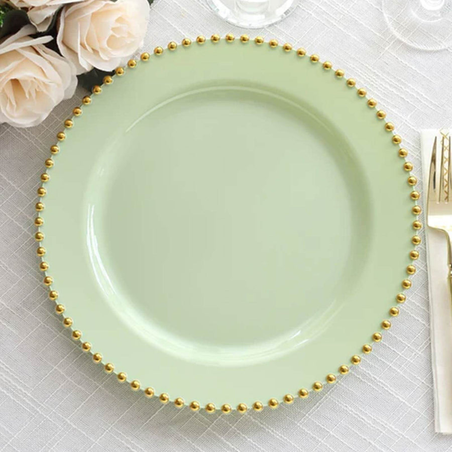 Mint green plate with gold beaded rim on a textured table setting.