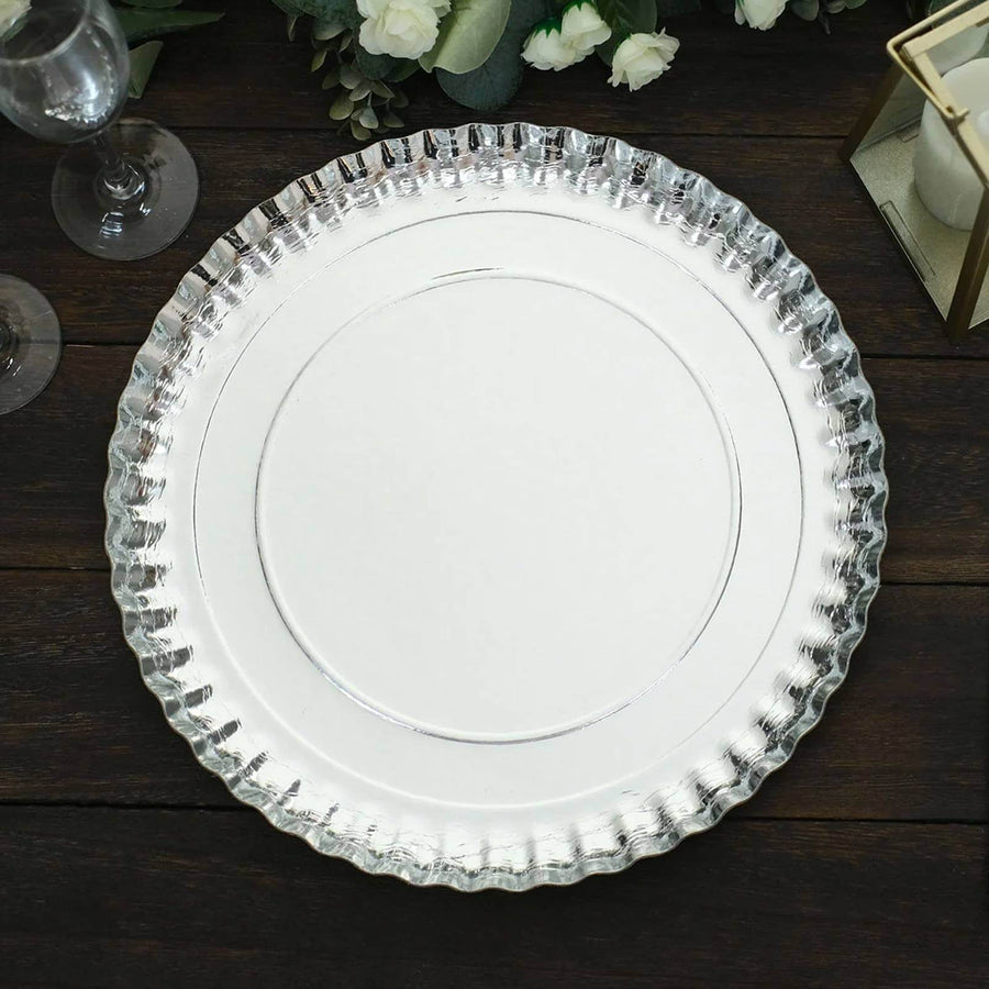 Elegant silver serving platter with a scalloped edge.