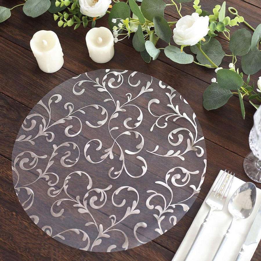 Decorative round placemat with elegant floral design on a rustic wooden table.