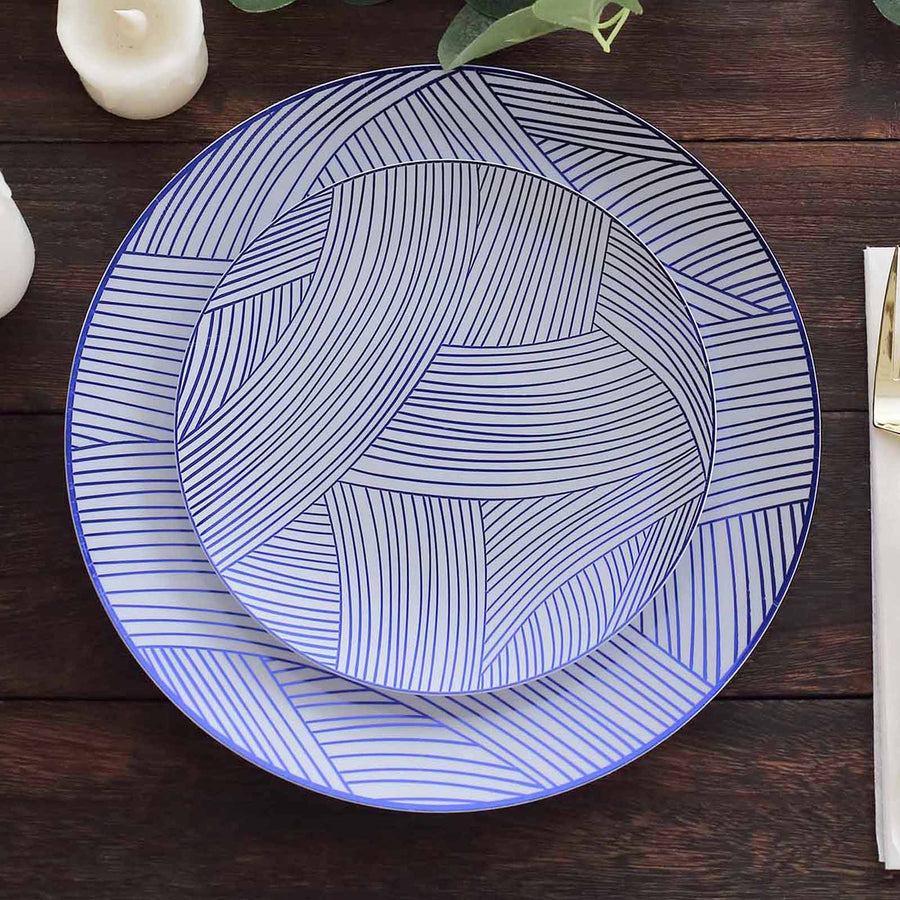Blue patterned serving plates stacked on a wooden table.