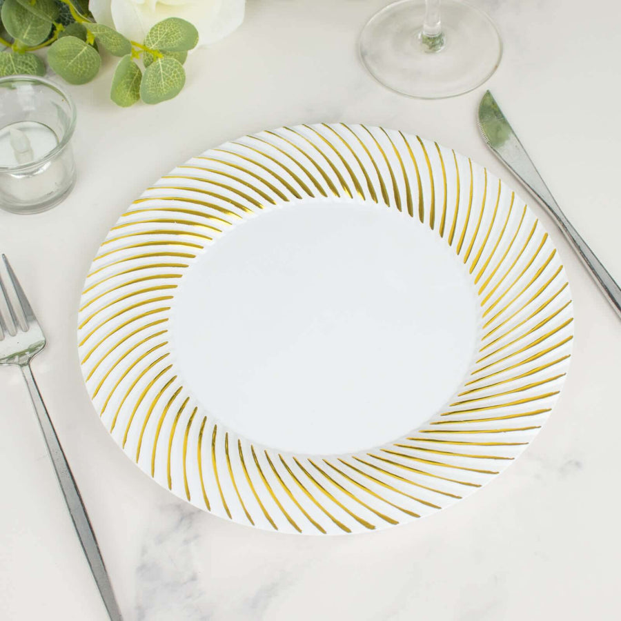 Elegant white plate with gold spiral design, perfect for dining occasions.