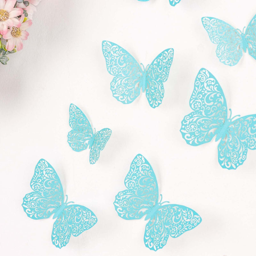 Decorative turquoise butterflies with intricate designs on a white background.