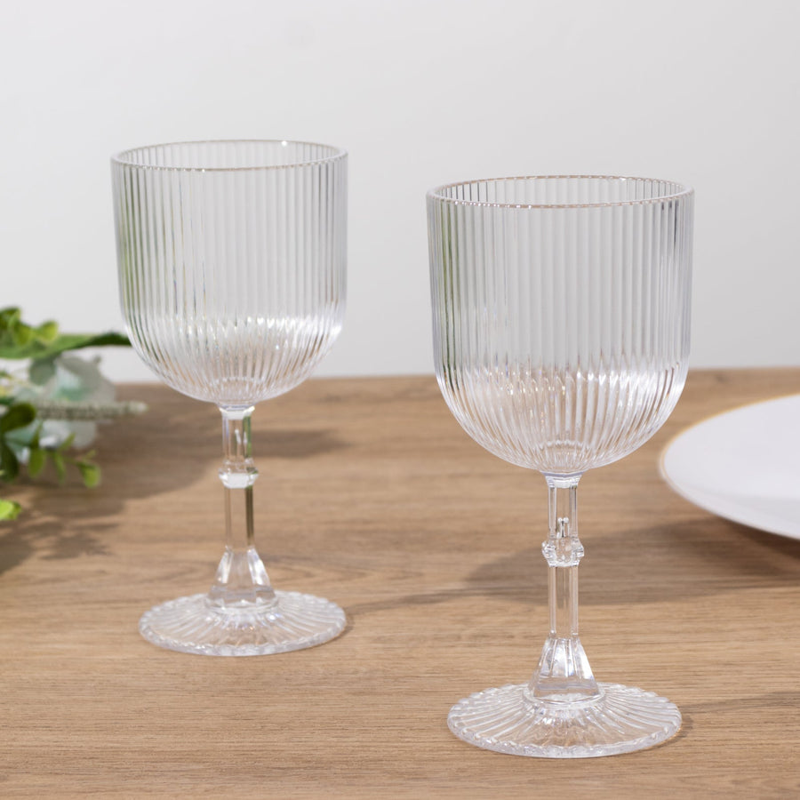 Elegant ribbed glassware set on a wooden table.