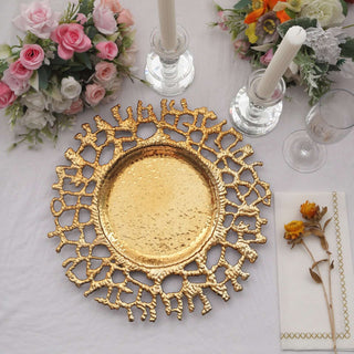 Gold decorative plate with intricate design, surrounded by flowers and candles.