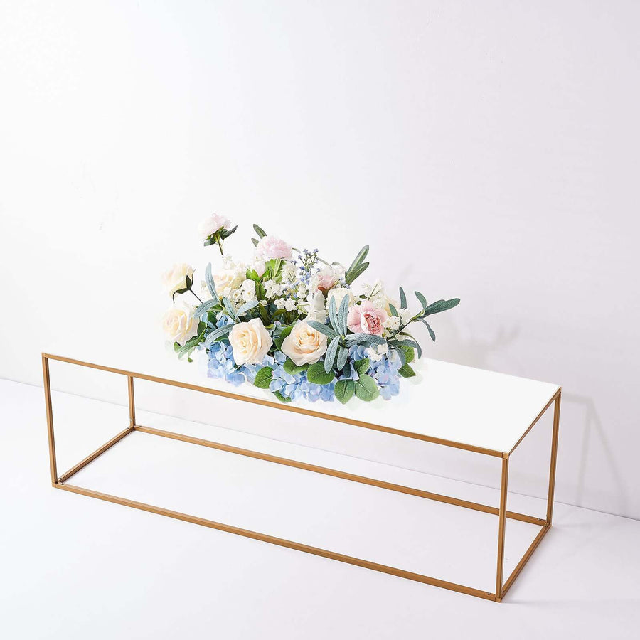 Coffee table with floral arrangement and gold frame