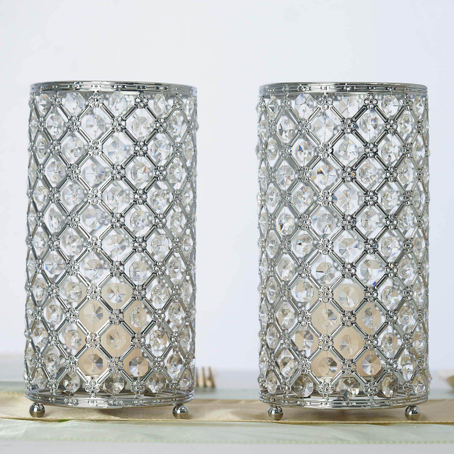 Elegant silver and crystal candle holders in a studio shot.