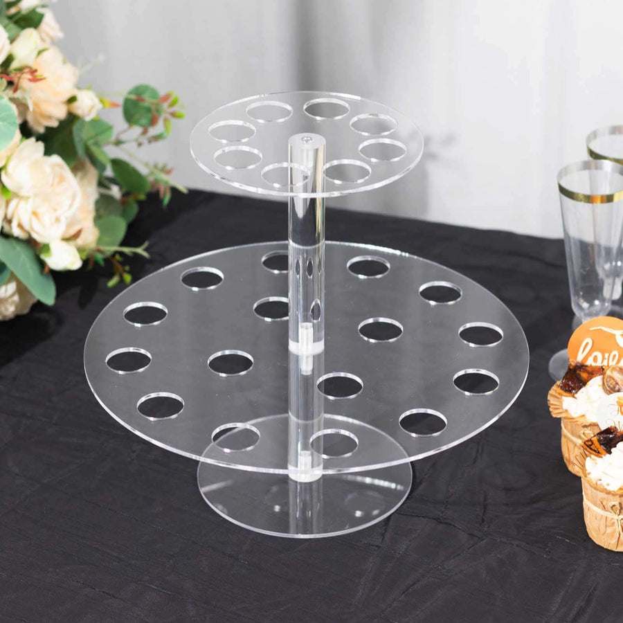 Acrylic cupcake stand with two tiers and circular holes for display.