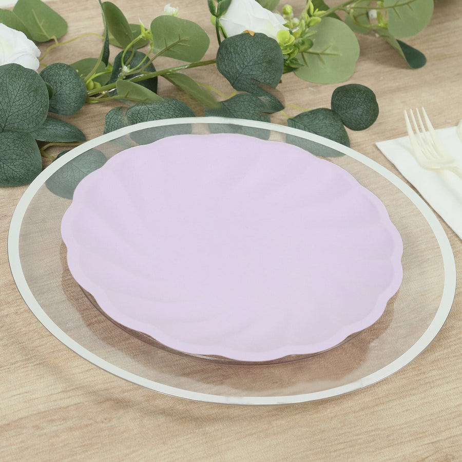 Purple scalloped plate on a clear glass charger with greenery background.