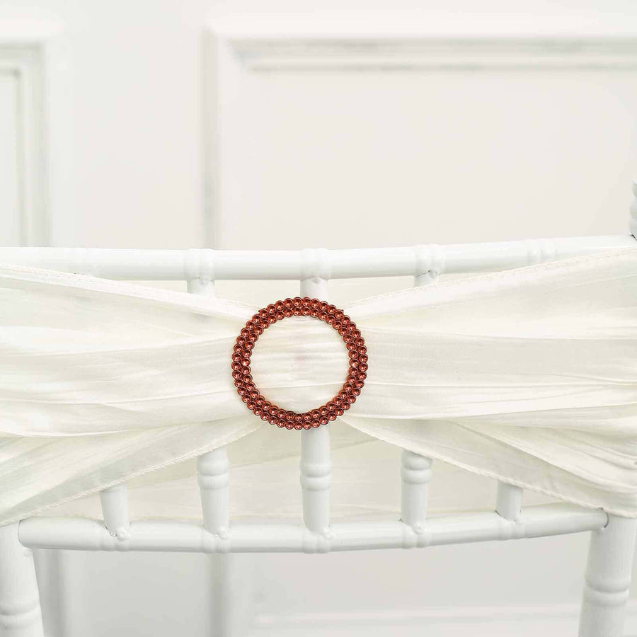 White chair sash with braided brown ring detail