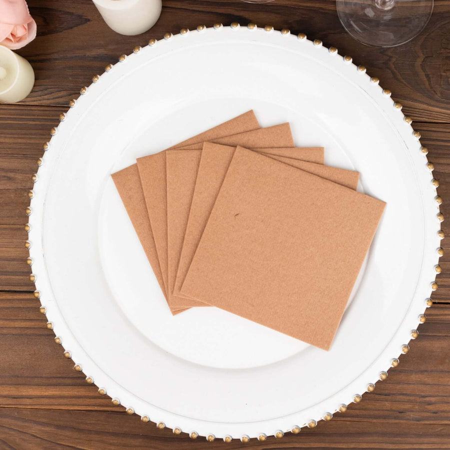 Brown cardstock squares arranged on a decorative plate.
