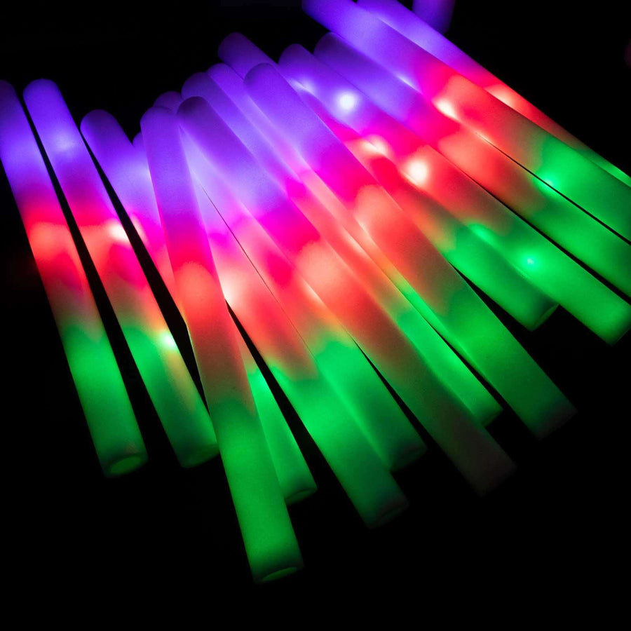 Colorful glowing light sticks in vibrant pink, green, and blue hues.