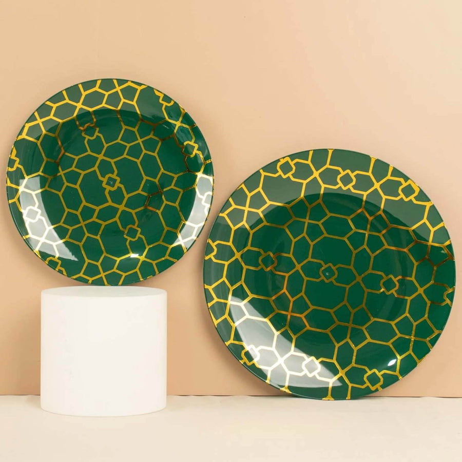 Green and gold patterned plates displayed against a neutral background.