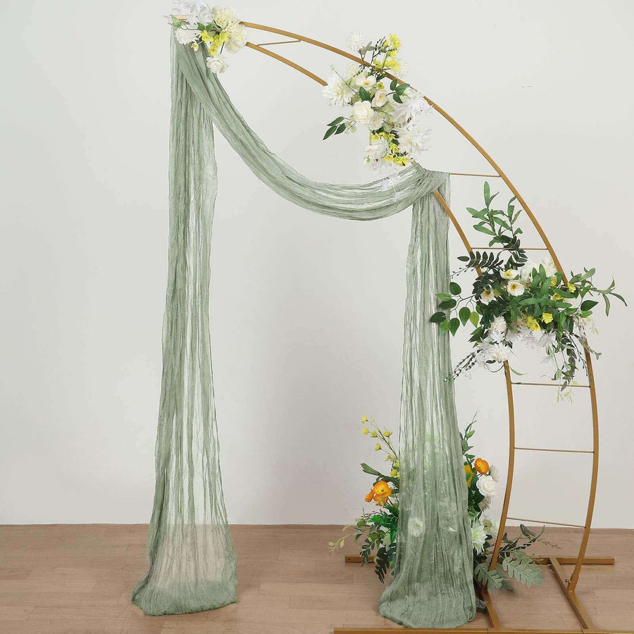 Green draped fabric and floral arch decoration for events or weddings