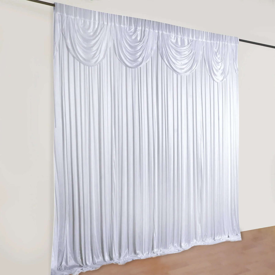 White satin drapery with pleats, ideal for events and photography backdrop.