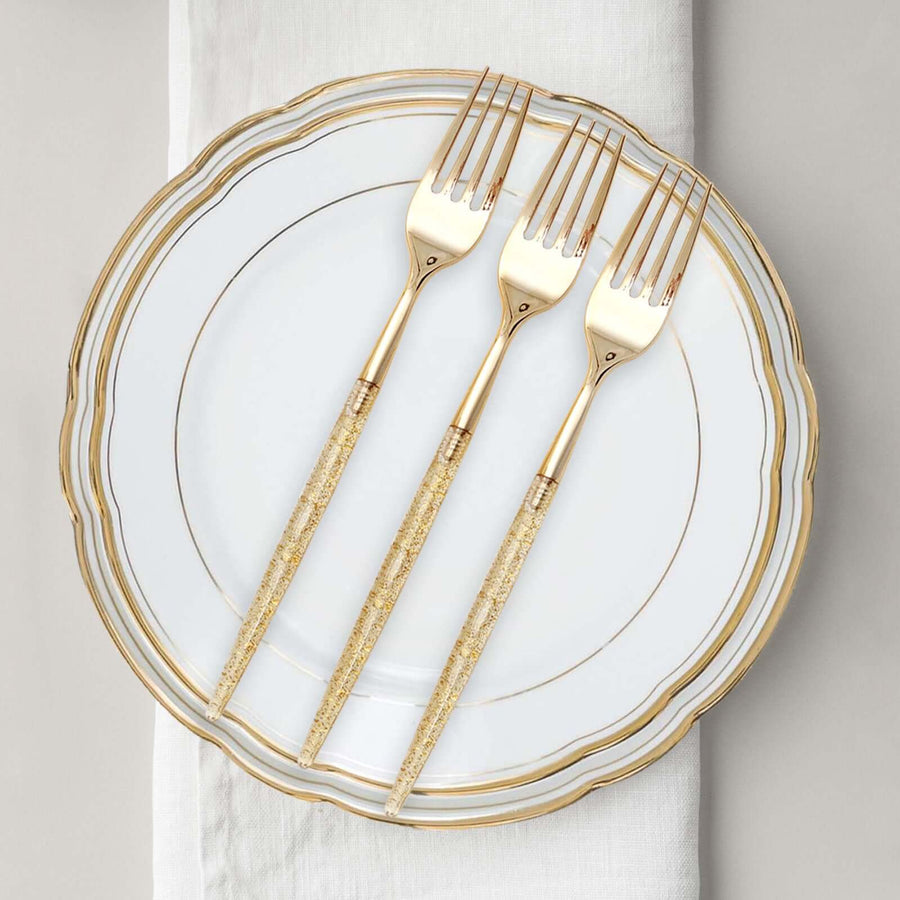 Elegant gold-handled forks on a white plate with gold trim.