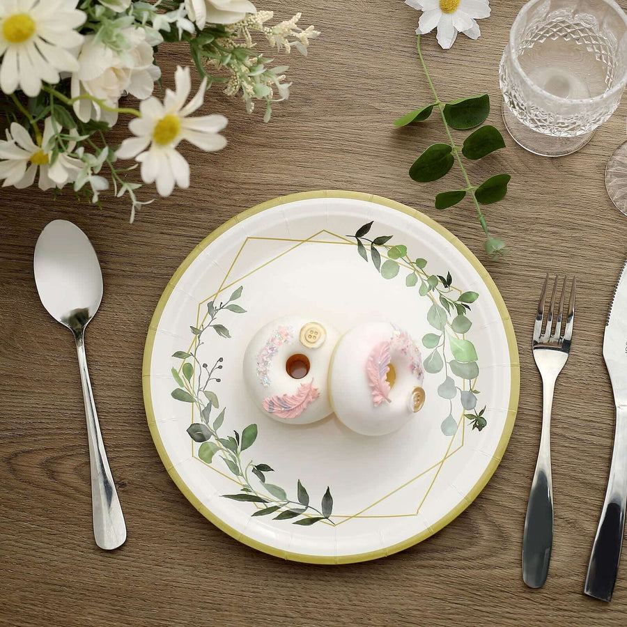 Decorative plate with donuts and floral design on a wooden table setting.