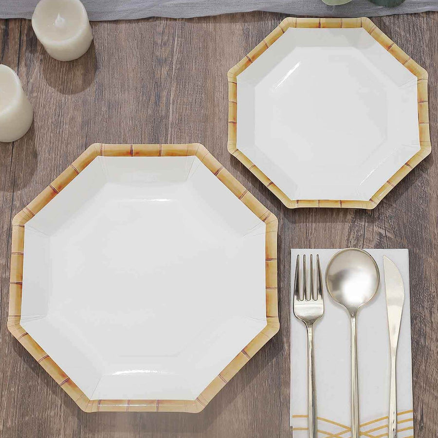 White octagonal plates with bamboo design, arranged with silver cutlery.