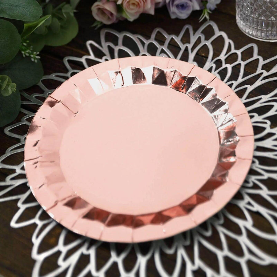 Rose gold paper plate on a decorative lace doily.