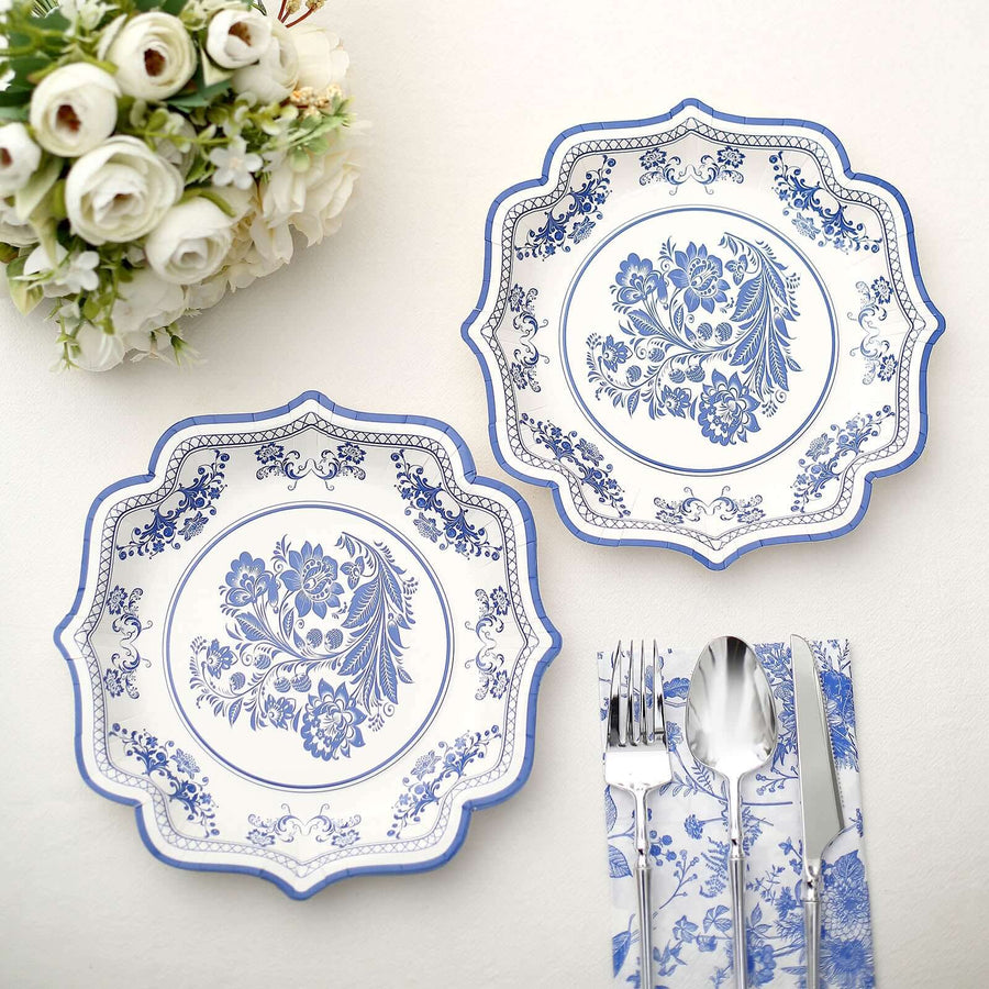 Elegant blue and white floral dinner plates with matching cutlery.