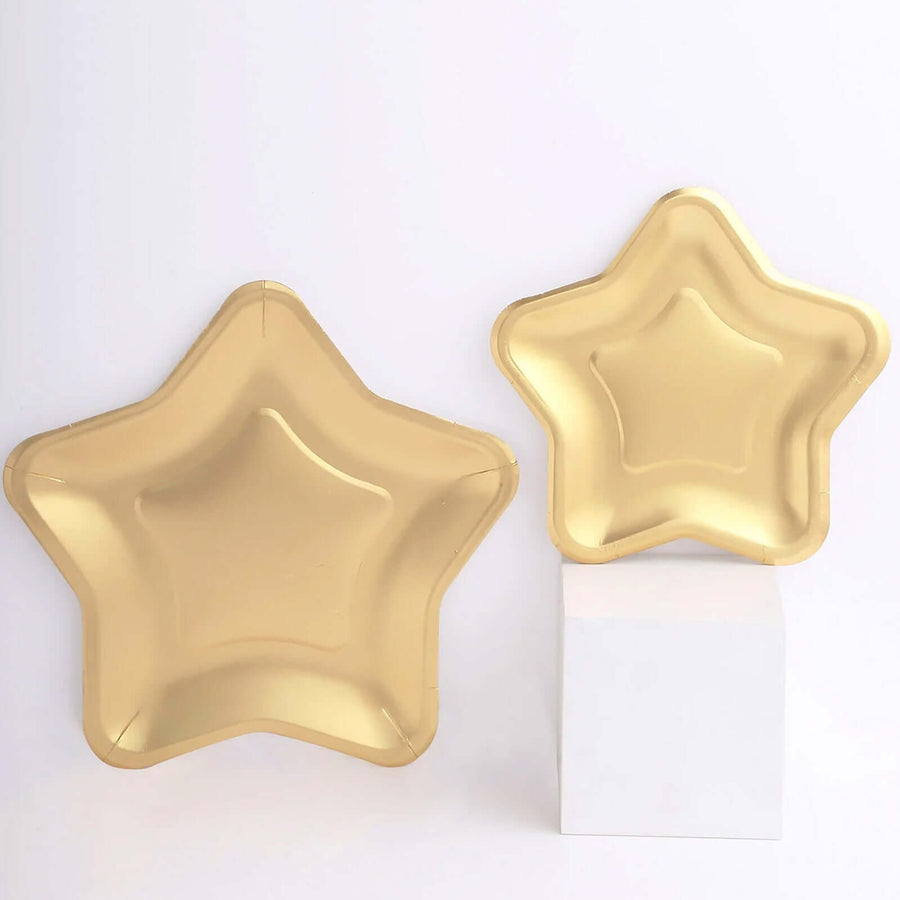 Gold star-shaped plates in two sizes against a plain background.