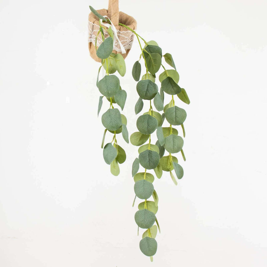 Artificial eucalyptus plant in a hanging burlap holder