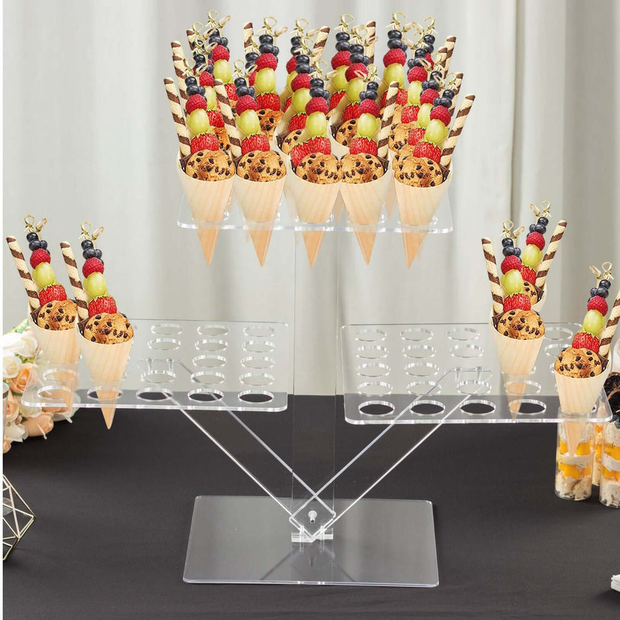 Acrylic dessert stand holding assorted ice cream cones with fruit toppings.