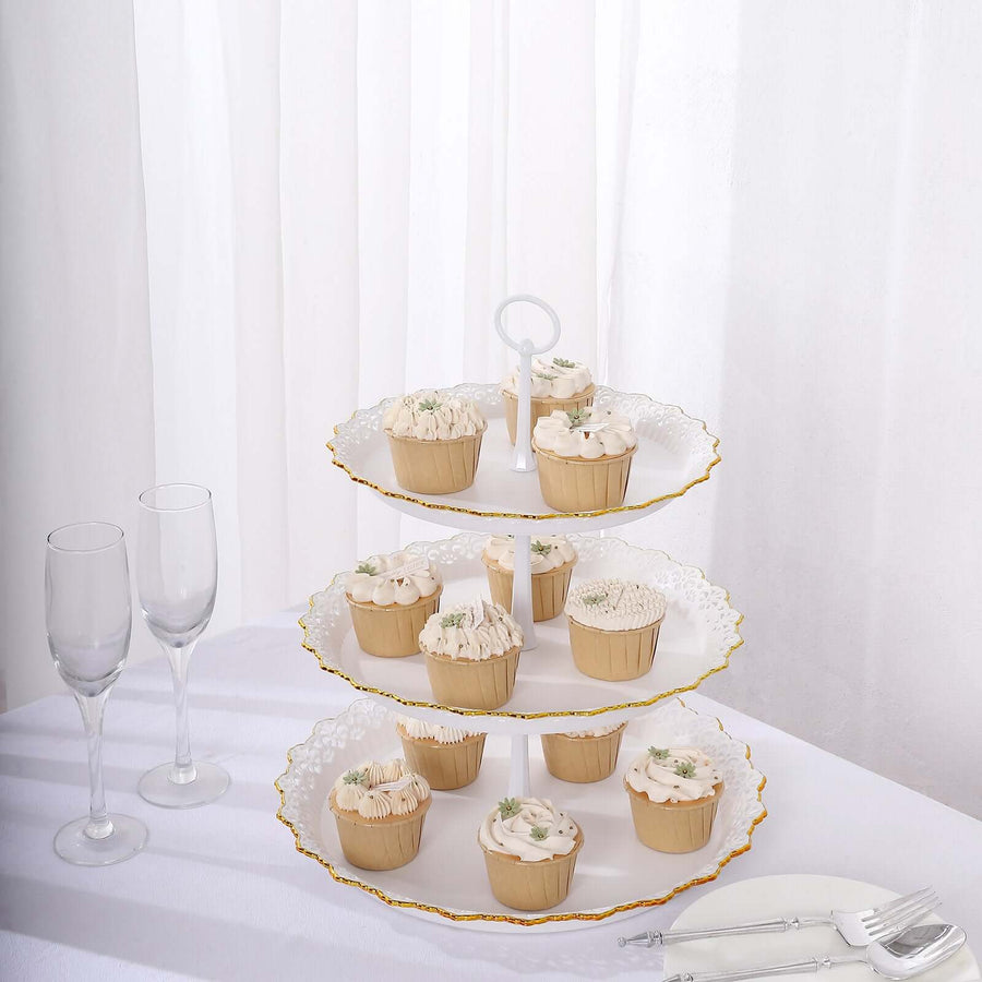 Three-tiered dessert stand with cupcakes and champagne flutes