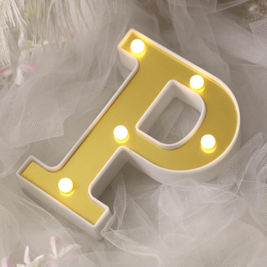 Illuminated letter "P" decorative sign with yellow and white design.