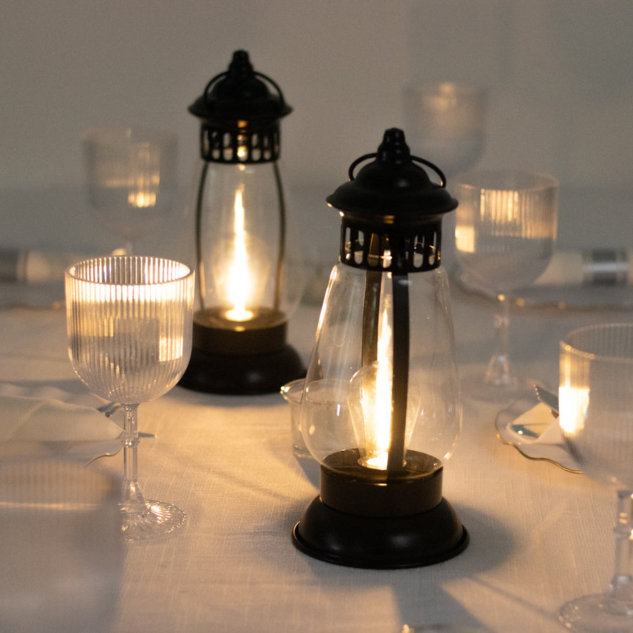Vintage-style lanterns illuminating a dining table setting.