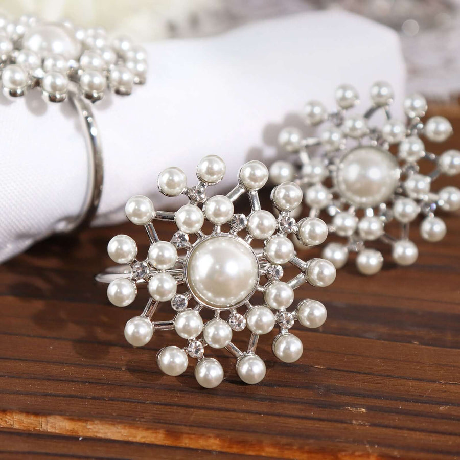 Elegant pearl and crystal jewelry set on a wooden surface.