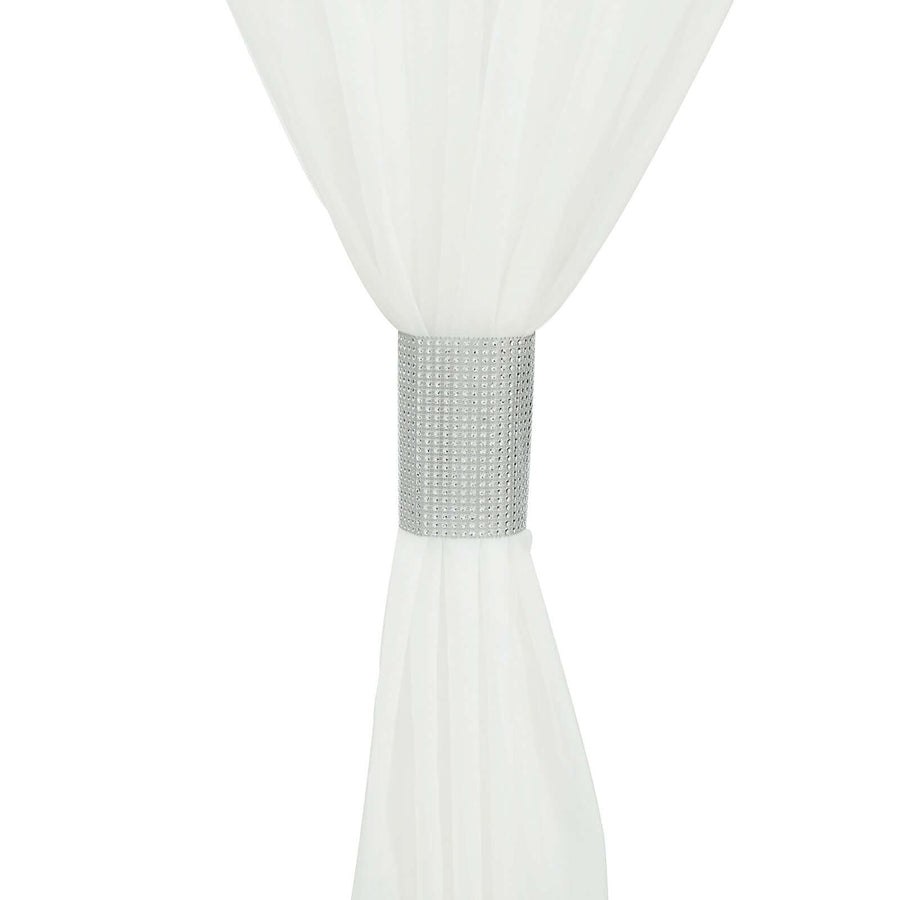 White sheer curtain with silver jeweled tieback
