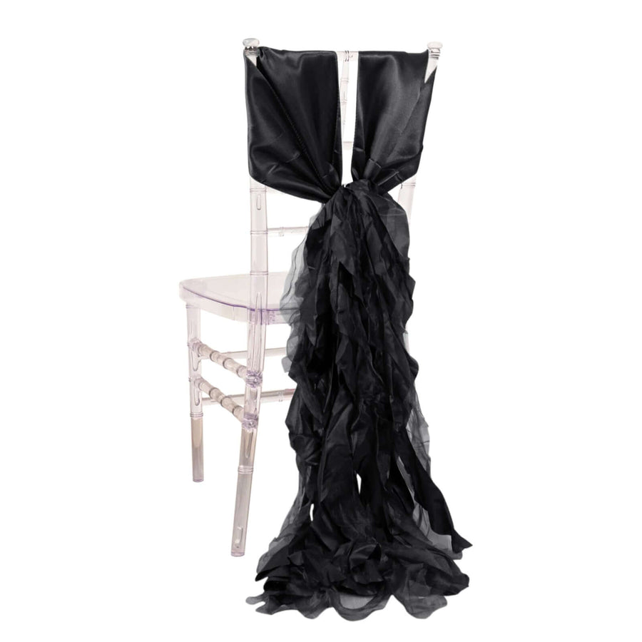 Black ruffled chair sash draped elegantly on a clear chiavari chair
