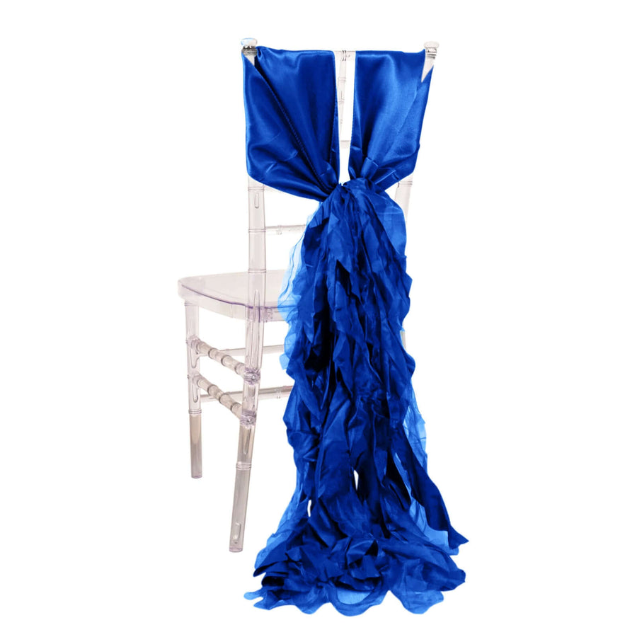 Blue satin chair sash draping elegantly down a clear chair.