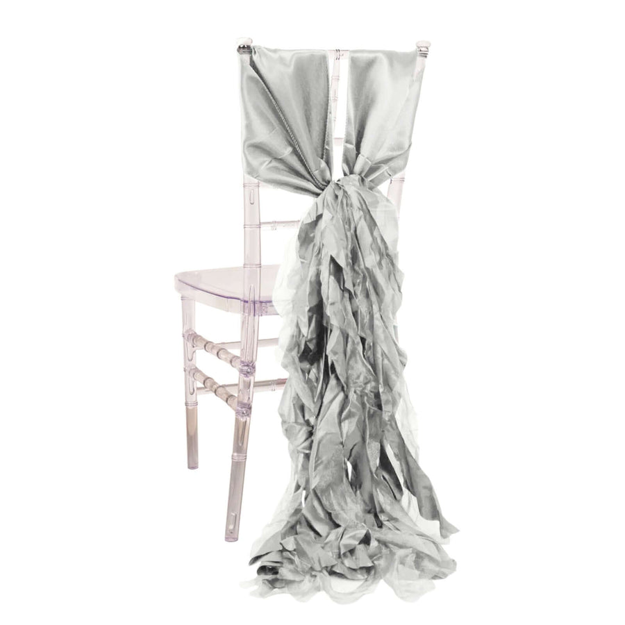 Elegant silver chair sash draped on a clear Chiavari chair for event decor.