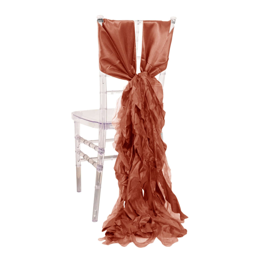 Rust-colored chair sash draped elegantly on a clear chiavari chair