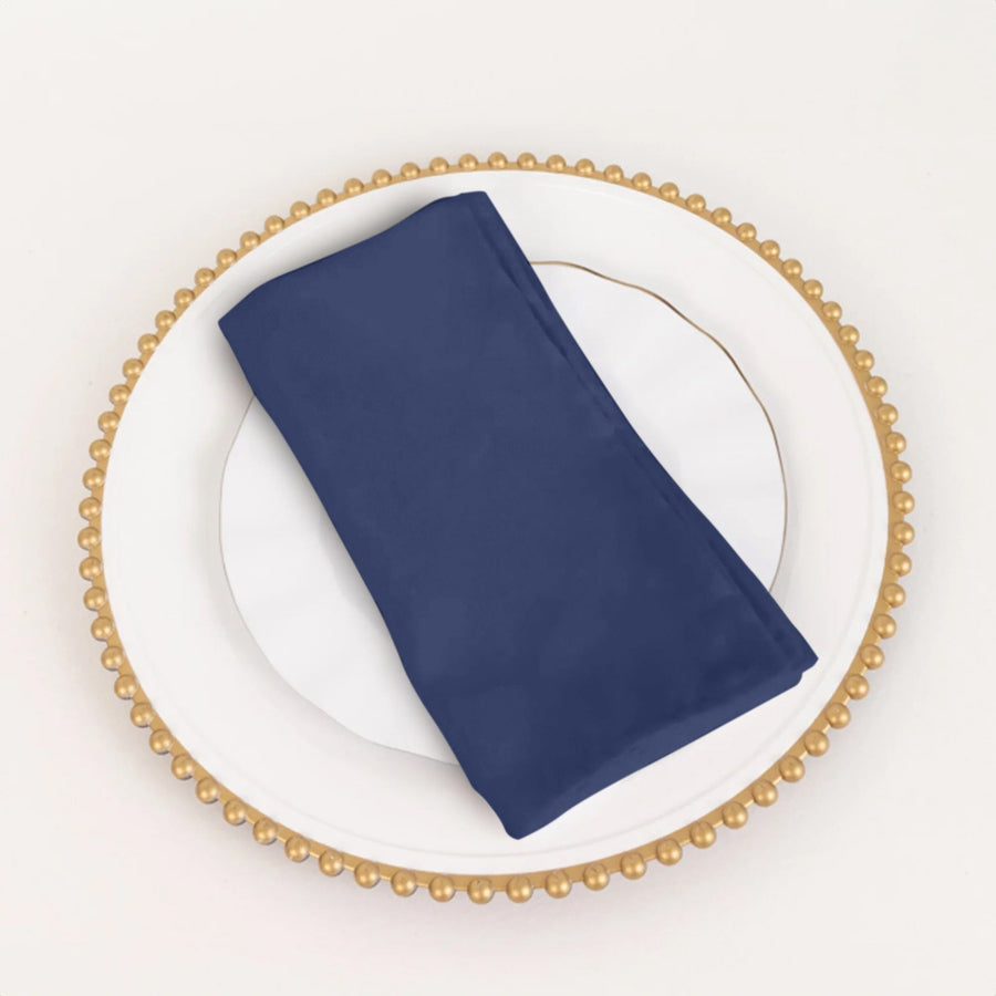 Navy blue napkin on a decorative plate