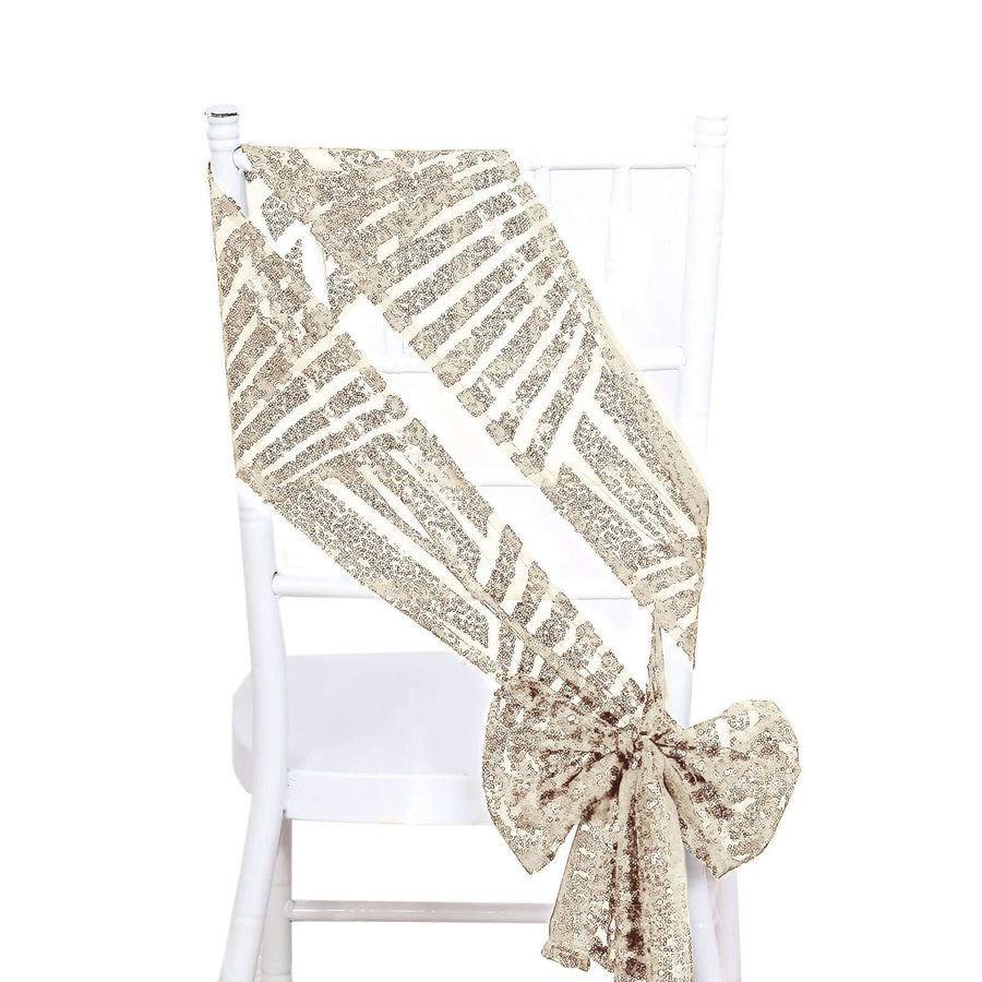 Gold sequin chair sash with palm leaf design tied in a bow on a white chair