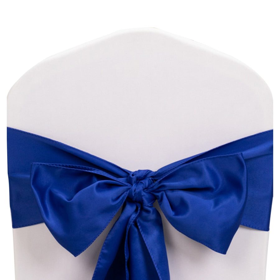 Blue satin chair cover bow on a white chair.